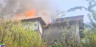 A shed built for drying rubber sheets adjacent to the house caught fire