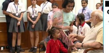 SCHOOL GIRL TIE RAKHI TO PM/