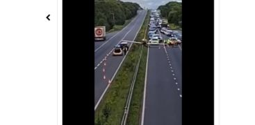 PLANE CRASH LANDS ON ROAD TRAFFIC STANDSTILL 