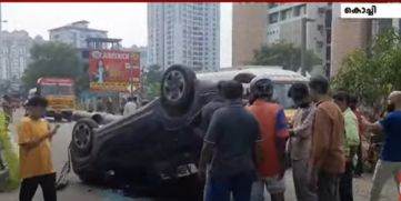 Car Overturns After Crashing into Divider