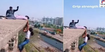 pune teens risk life hangs from edge of building viral instagram reel 