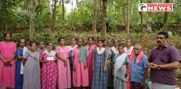 A group of indentured laborers with hand in hand for Wayanad