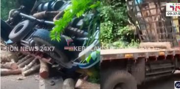 A lorry carrying wood overturned at Thamarassery pass