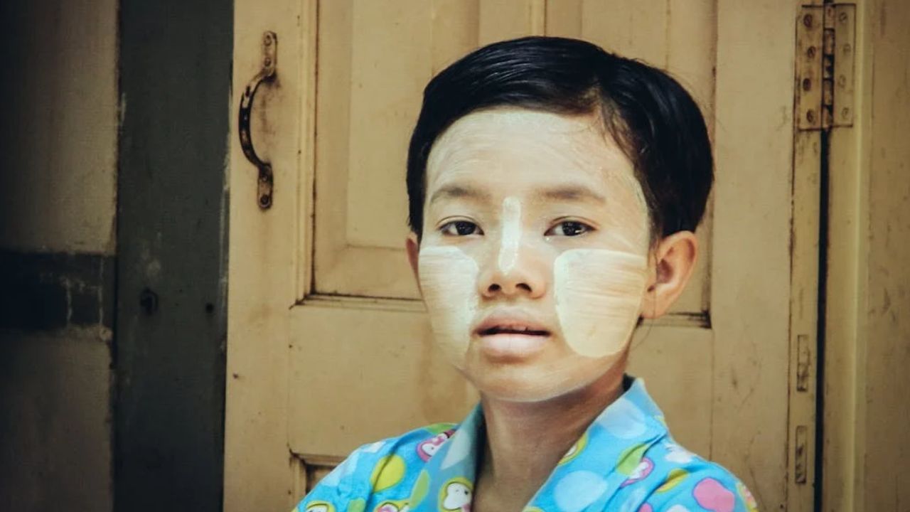 A Child with Thanaka on Her Face
