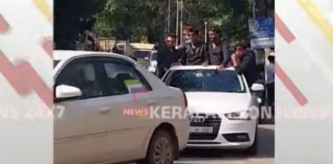  Students travel by sitting on top and doors of vehicles